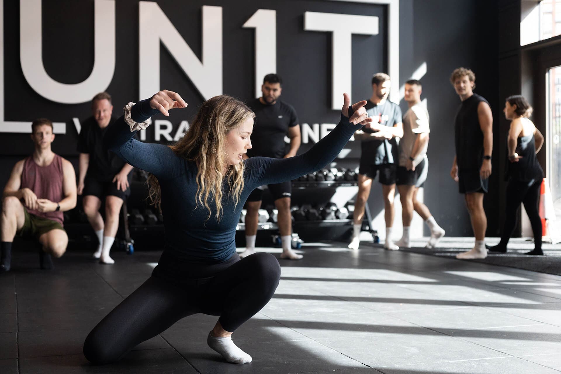 An MXO coach leading a group fitness class