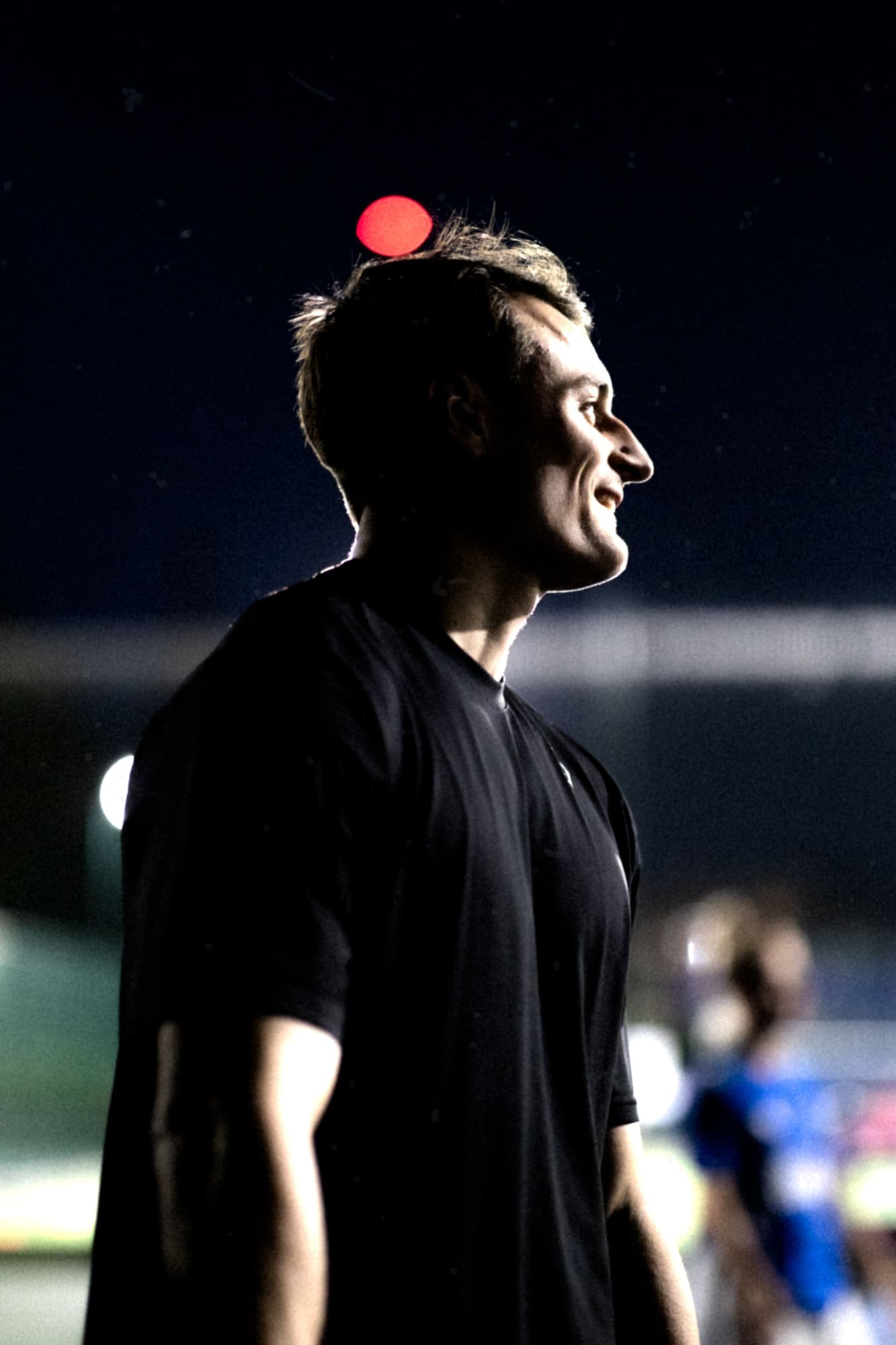 Portrait of an MXO performance coach at an evening training session